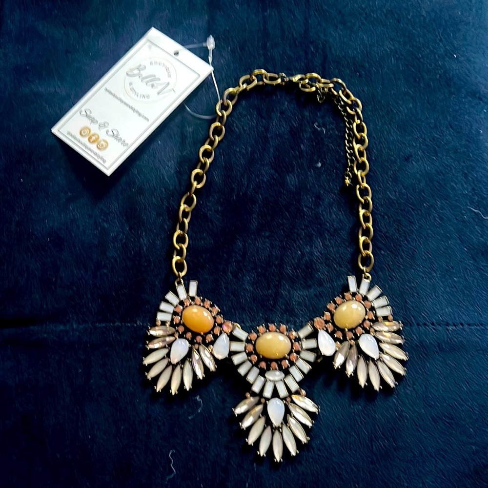 Statement necklace. Gold cabin with lavender, rose and taupe colored gems